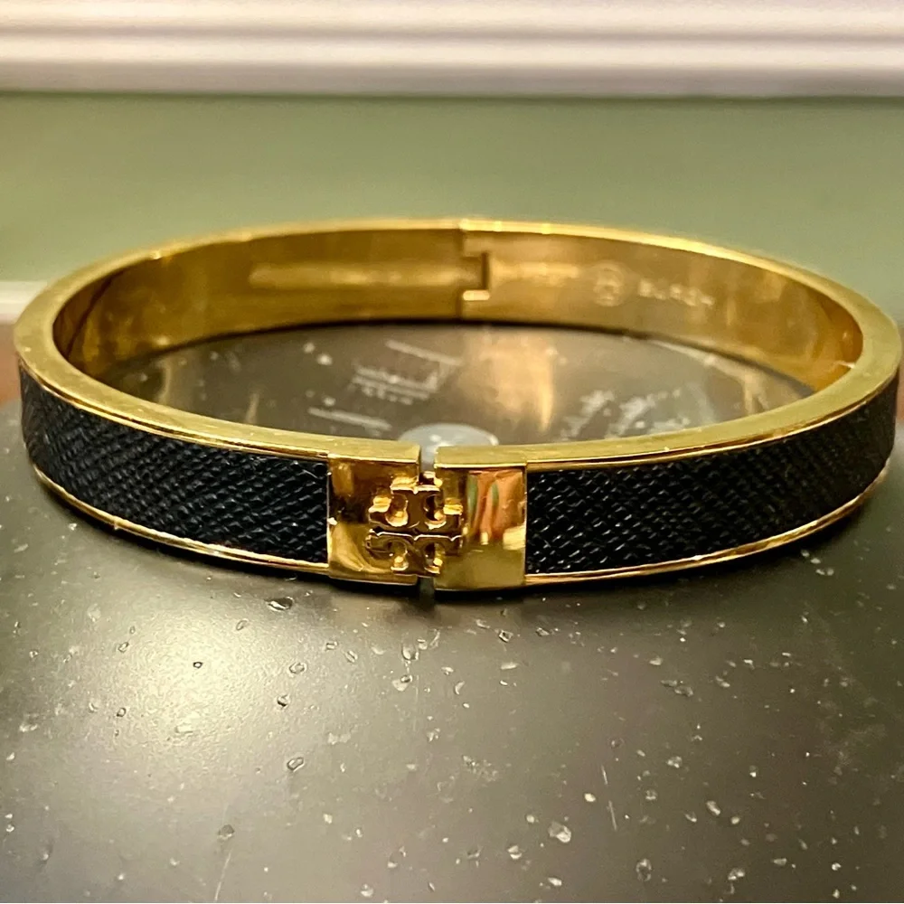 Tory Burch - 1/2” Black Leather Inlay Gold Hinged Bracelet - Picture 1 of 11